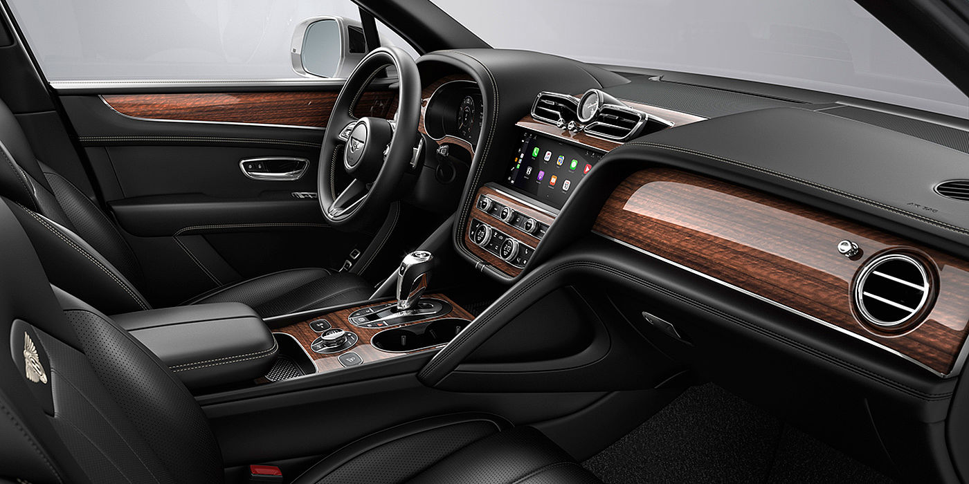 宾利东莞 Bentley Bentayga interior with a Crown Cut Walnut veneer, view from the passenger seat over looking the driver's seat.
