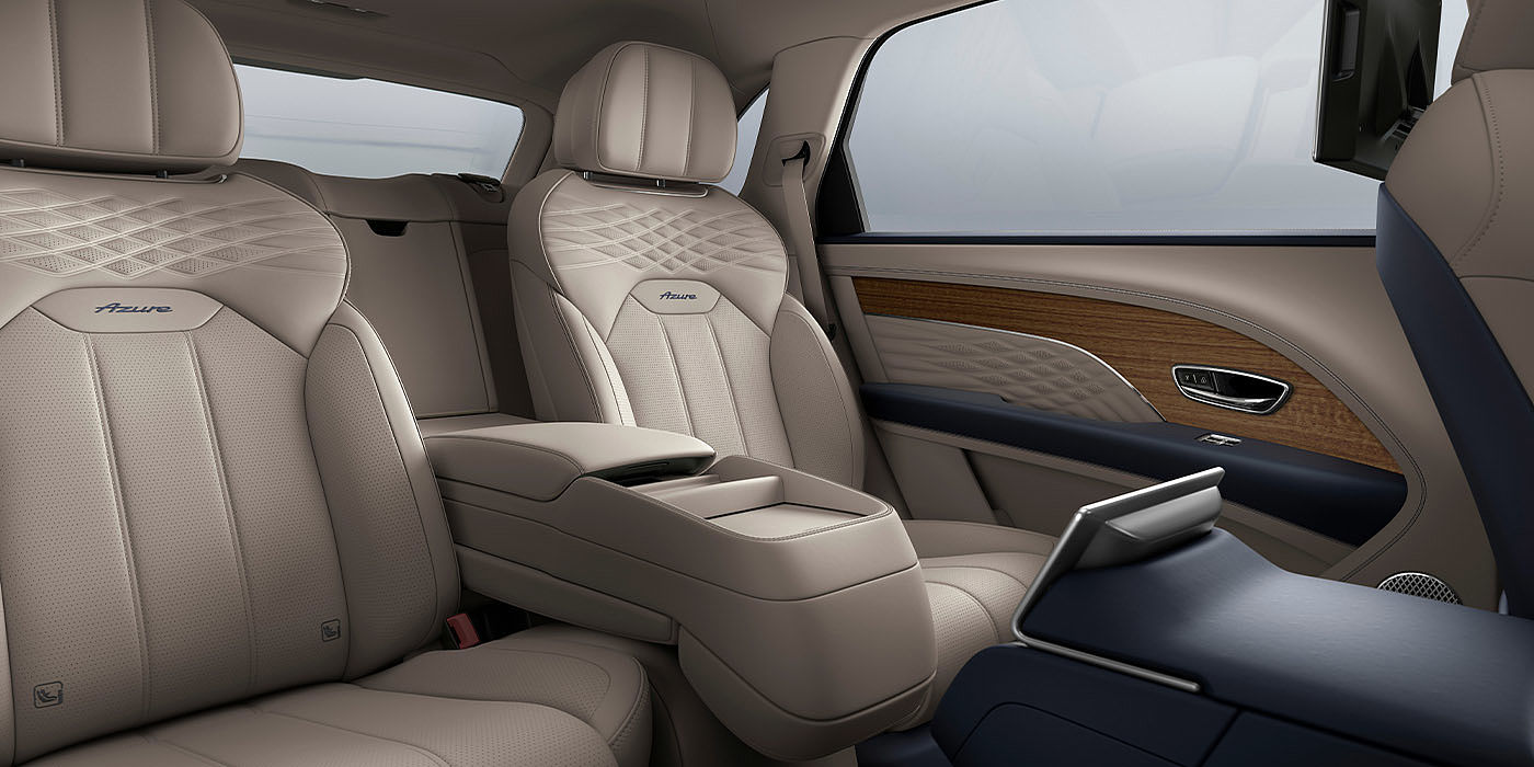 宾利东莞 Bentley Bentayga EWB Azure interior view for rear passengers with Portland hide featuring Azure Emblem in Imperial Blue contrast stitch.